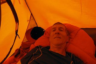 17 Jerome Ryan Resting In Tent Waiting For Clouds To Clear From K2 North Face At Intermediate Base Camp 4462m.jpg